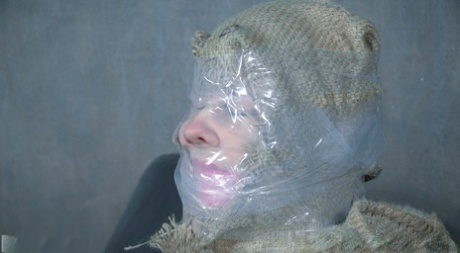 Caucasian girl Bonnie Day finds herself restrained in a dungeon after a stroll
