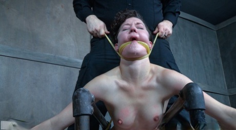 Caucasian girl Bonnie Day finds herself restrained in a dungeon after a stroll