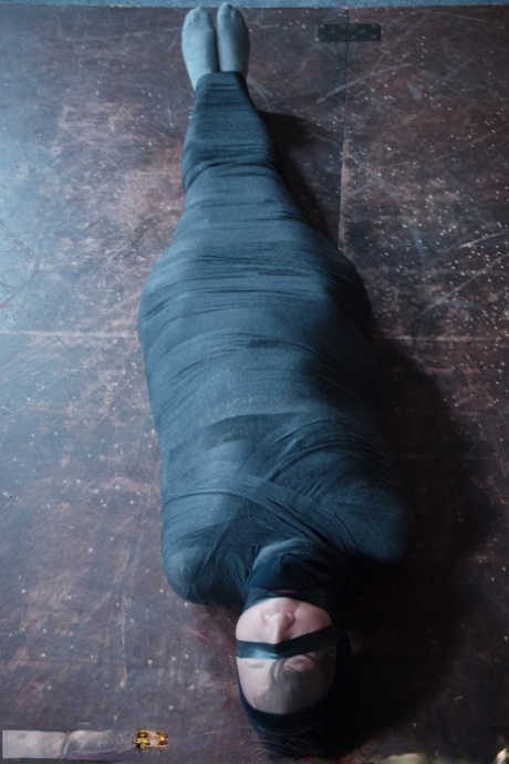 Caucasian girl Bonnie Day finds herself restrained in a dungeon after a stroll