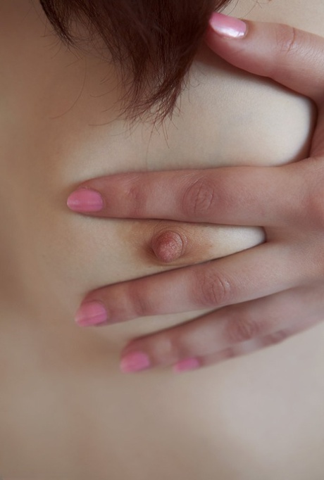 Latvian teen Margo puts her full bush on display during nude solo poses