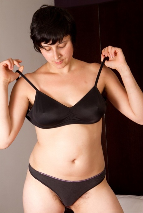 Busty chick Sarah S confidently displays her hairy underarms and bush