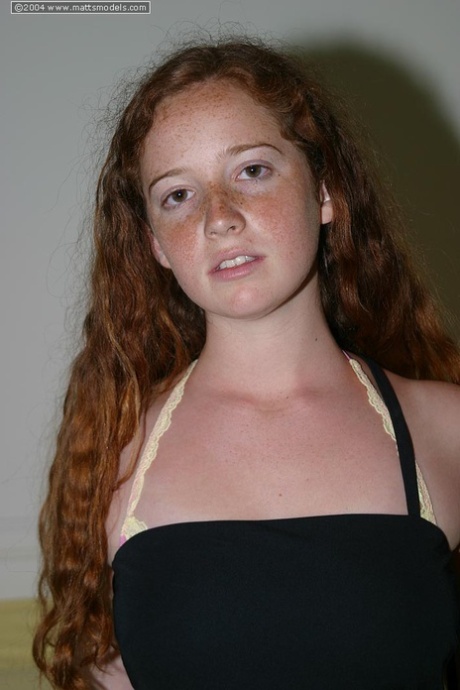 Flexible redhead Rachel showcases her natural pussy after lingerie removal