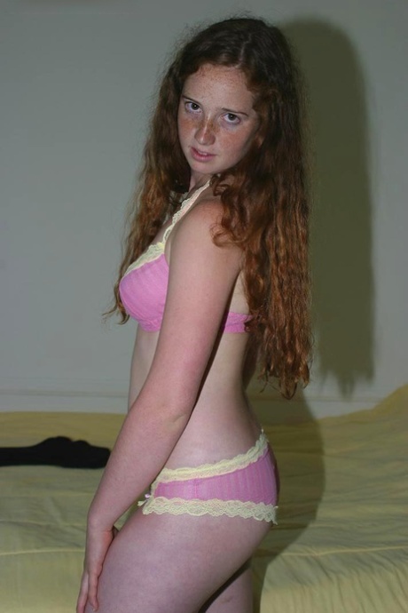 Flexible redhead Rachel showcases her natural pussy after lingerie removal