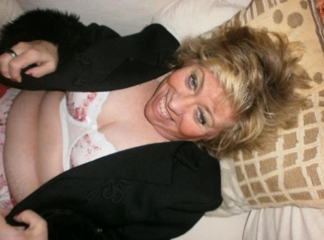 Crazy mature woman Caro takes her panties off and spreads her hairy coochie