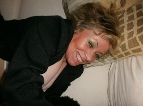 Crazy mature woman Caro takes her panties off and spreads her hairy coochie