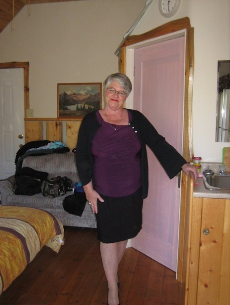 Fat granny Girdle Goddess exposes her pussy in crotchless panties and a girdle