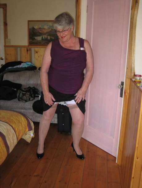 Fat granny Girdle Goddess exposes her pussy in crotchless panties and a girdle