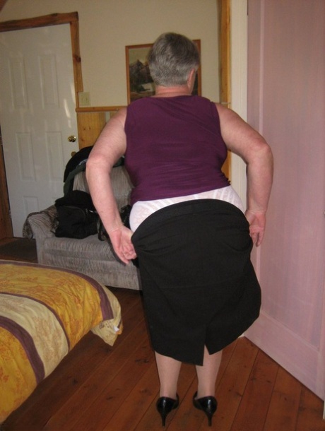 Fat granny Girdle Goddess exposes her pussy in crotchless panties and a girdle