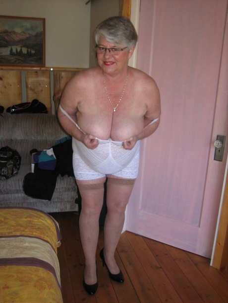 Fat granny Girdle Goddess exposes her pussy in crotchless panties and a girdle