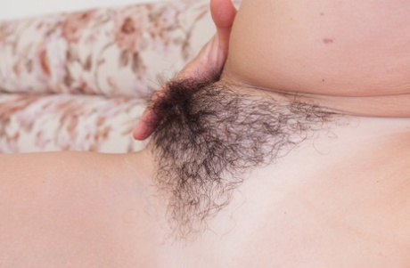 Mature lady Diana Douglas parts her hairy bush in her nude modeling debut