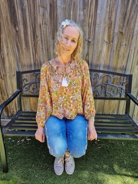 Old blonde woman Jacqueline goes nude on a blanket in socks and running shoes