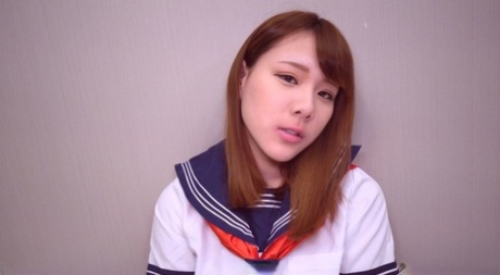 Japanese coed Yuri receives a creampie during POV sex on a bed
