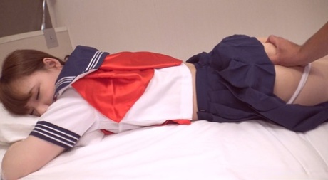 Japanese coed Yuri receives a creampie during POV sex on a bed