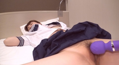 Japanese coed Yuri receives a creampie during POV sex on a bed