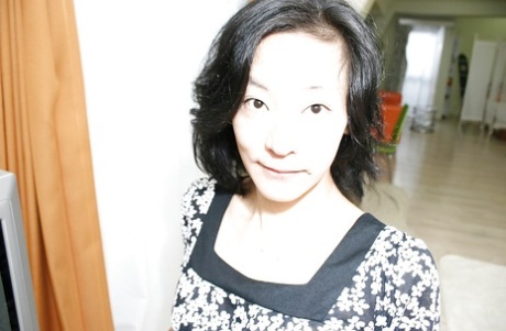 Naughty asian MILF Aya Sakuma undressing and exposing her holes