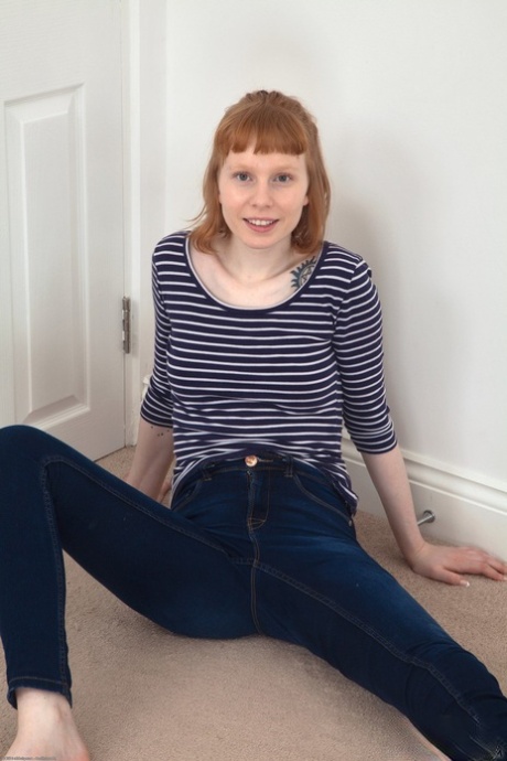 Norwegian ginger Bonni Belle undresses and reveals her hairy crotch