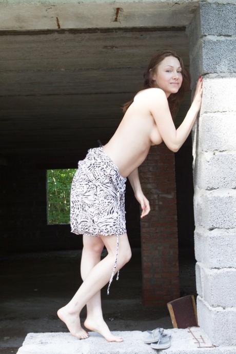 Slim girlfriend Nata displays her tiny breasts and rubs her bush in a solo