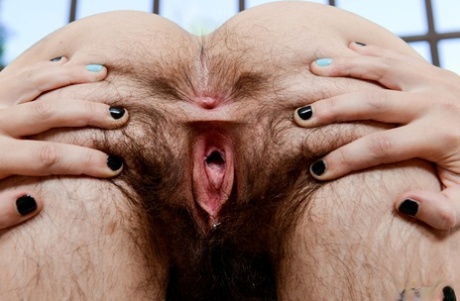 Brunette girl in glasses Anika Darling reveals her hairy muff and asshole