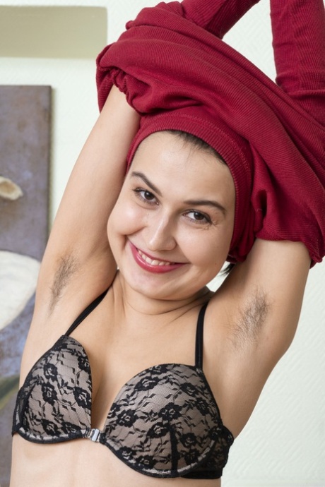 Dark haired teen with hairy armpits Eva Black strips and toys her bush