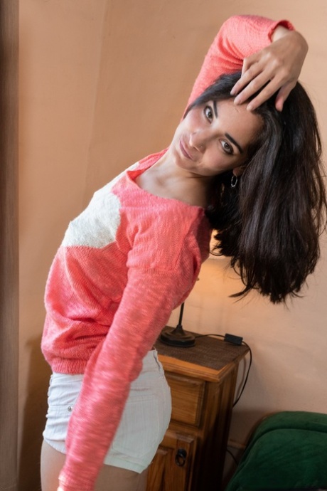 Brunette teen with tiny tits Tiffany exposes her hairy snatch in a solo