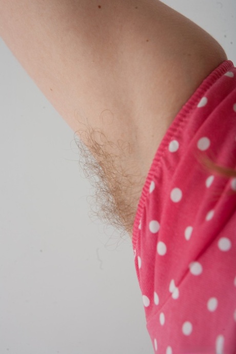 Small titted girl Coco strips off her clothes and displays hairy body