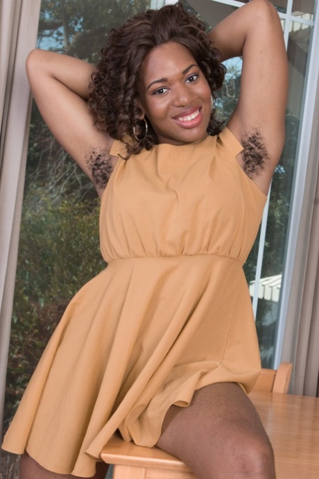 Voluptuous ebony Queen Bri shows her big hairy booty and fuzzy black pussy
