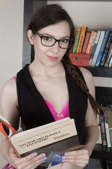 Cute babe with glasses Ember Stone gets naked and shows her hairy cunt