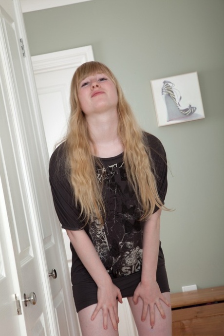 Curvaceous blonde Satine Spark flashes her hairy bush and natural tits