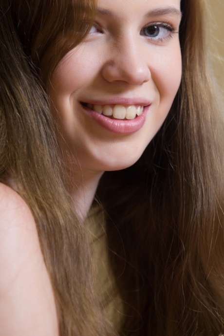Brunette teen Gillian A teases with her lovely boobs and tasty clam in a solo