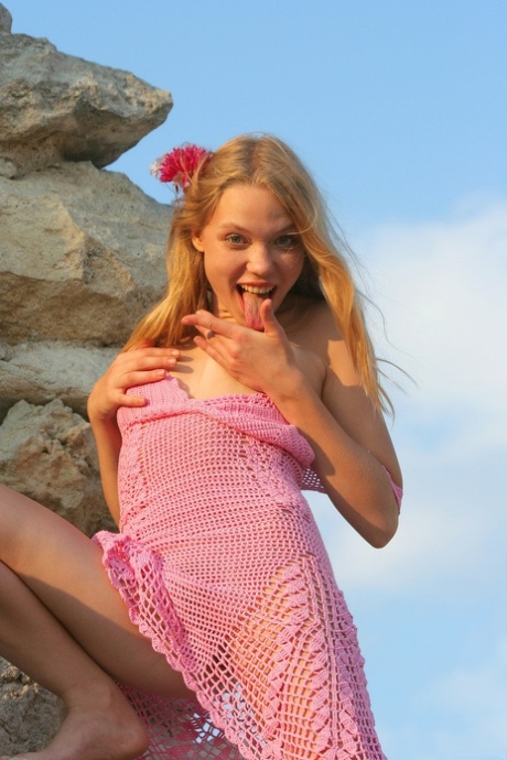 Young blonde Polly A shows her lovely teen tits & her trimmed bush outdoors