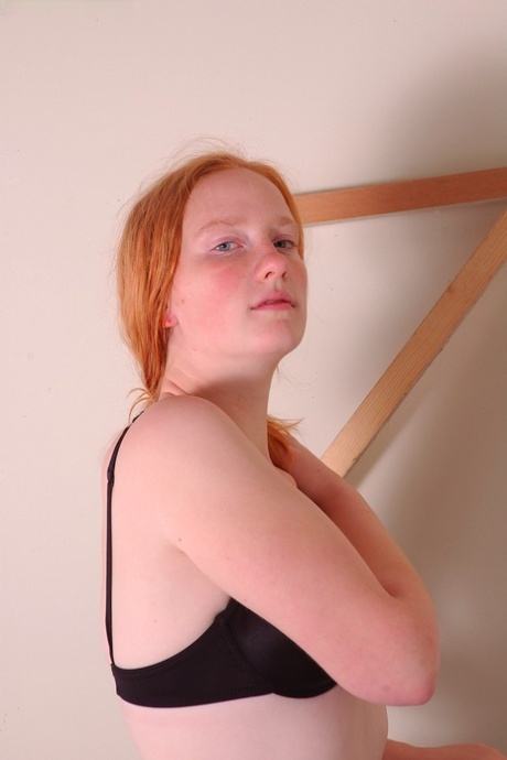 Amateur teen Claire strips and reveals her curvy body and furry pussy