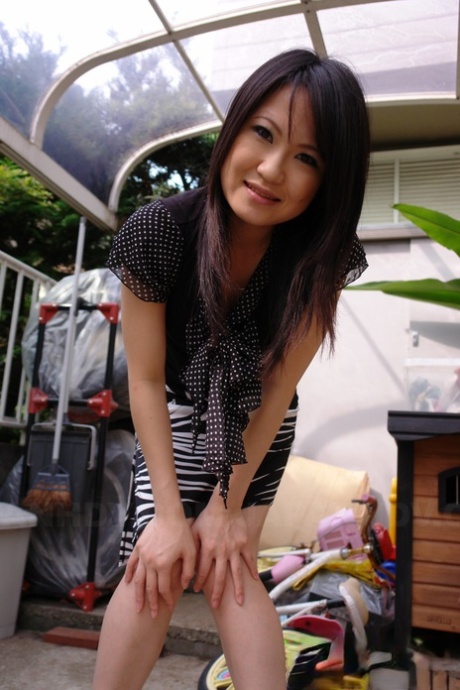 Brunette Asian girl Yoshimi Inamori flaunts her bush before getting fucked