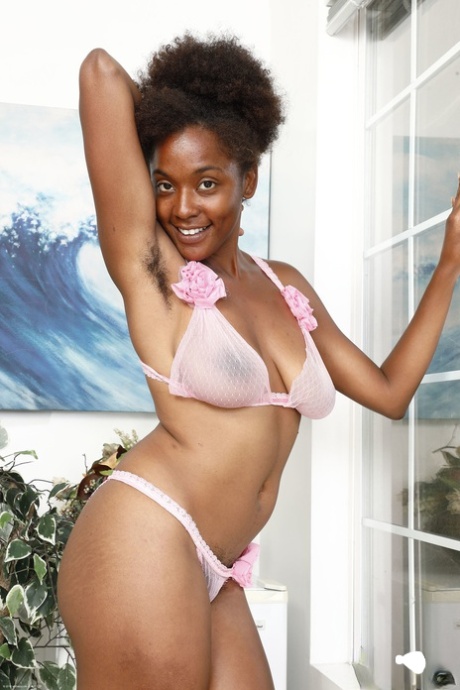 Ebony babe Panreece sets her saggy tits free and spreads her hairy pussy