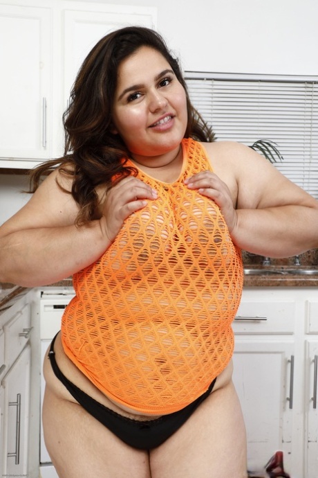 Chubby amateur Karla Lane unveils her big tits and hairy pussy in a solo