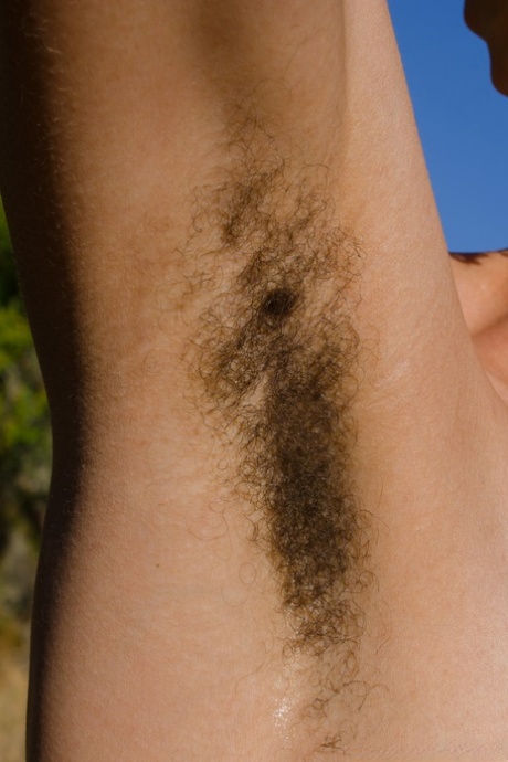 Exotic ebony Kendi Oh unveils her hairy tattooed body in nature