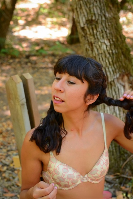 Latina Vivi Marie strips and shows her hairy cunt while camping in the woods