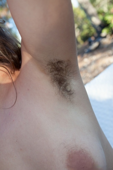 Amateur wife Nikki Silver fingers her bushy clam while exposing her hairy body