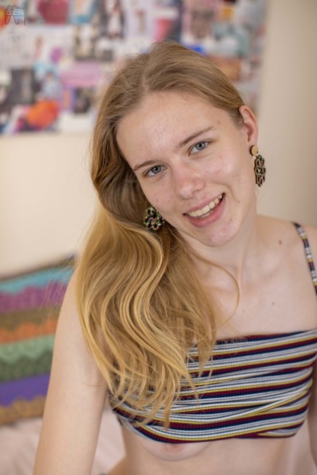 Australian teen Clara M flaunts her hairy snatch in a sexy striptease