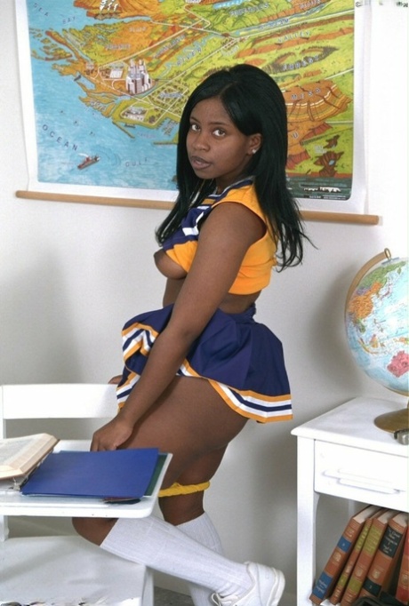 Black amateur cheerleader Holly flaunts her big tits and big ass in a solo