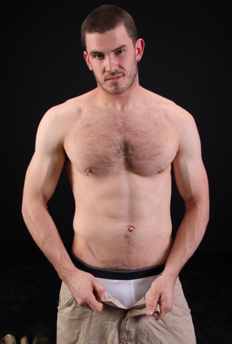Dark-haired gay model Vander unveils his big hairy dick as he strips
