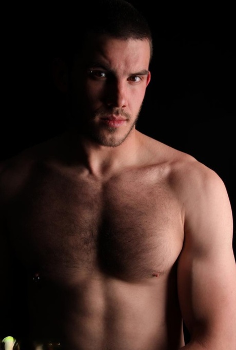 Dark-haired gay model Vander unveils his big hairy dick as he strips