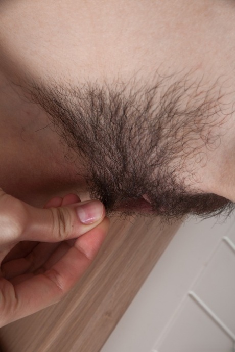 Amateur housewife Lolita strips & shows her furry vagina while making a salad