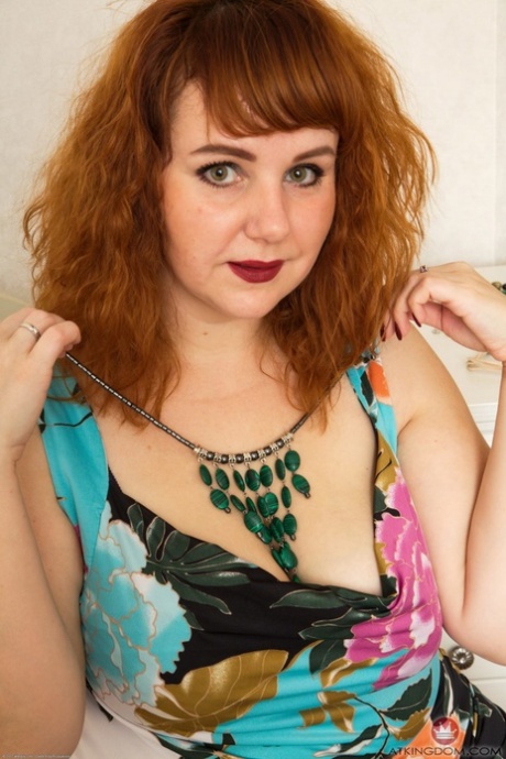 Redheaded BBW Katrin Porto flaunts her huge ass and hairy vagina