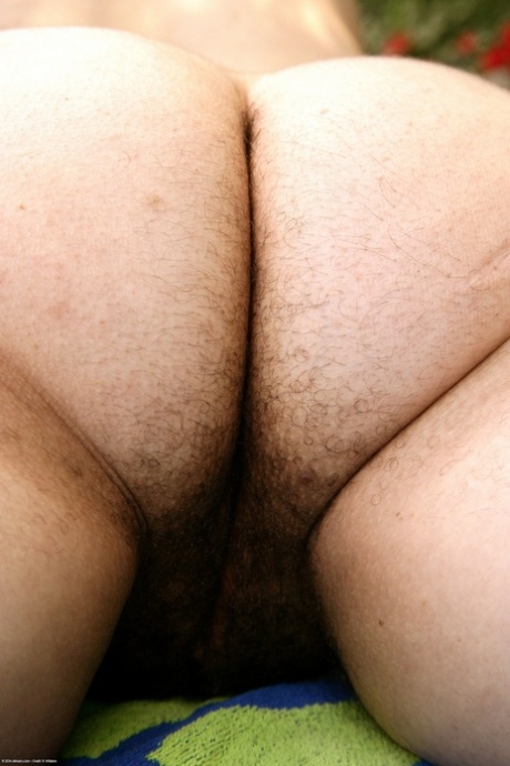 Exotic fatty Marie strips her bikini and shows her furry crotch outside