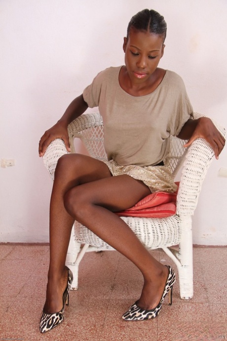 Sweet ebony teen Kaia doffs her elegant outfit and spreads her bushy cunt