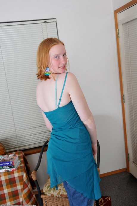 Ginger amateur teen Sandy flaunts her body and rubs her bushy twat