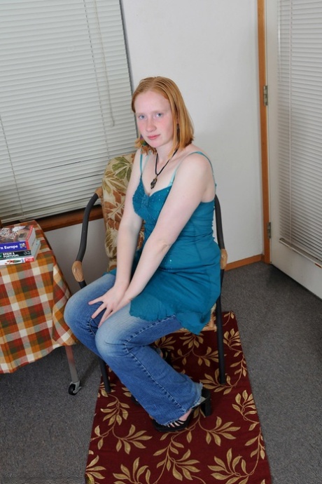 Ginger amateur teen Sandy flaunts her body and rubs her bushy twat