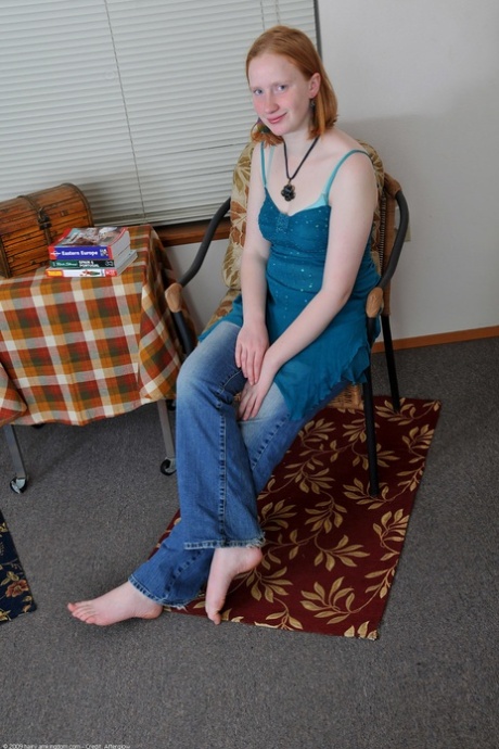 Ginger amateur teen Sandy flaunts her body and rubs her bushy twat