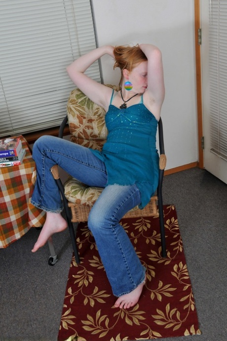 Ginger amateur teen Sandy flaunts her body and rubs her bushy twat