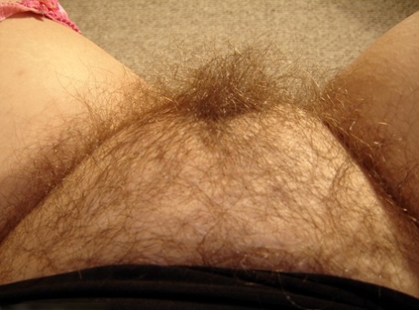 Fat blonde amateur Amber exposes her saggy juggs and hairy pussy up close